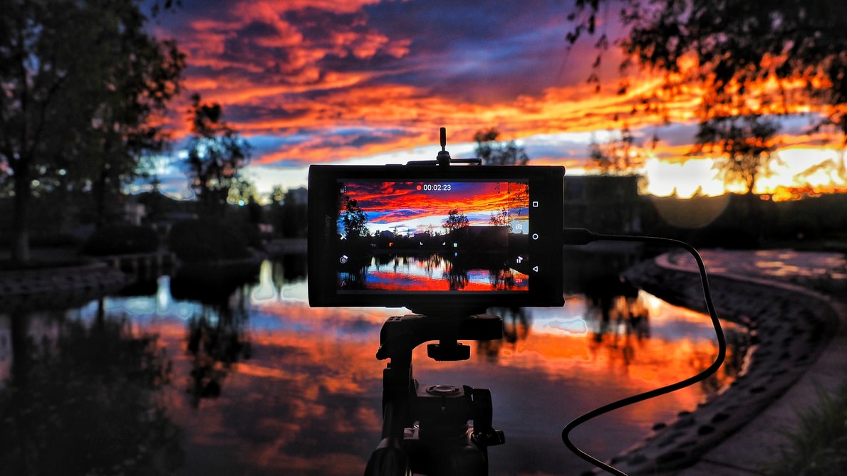 camera mounted to take photo of water and trees